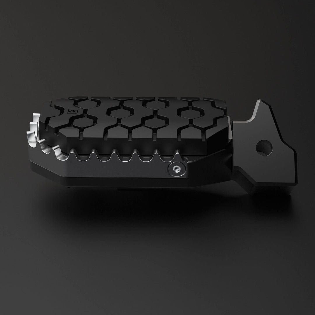 Image of one motorcycle foot peg with rubber to protect a boot