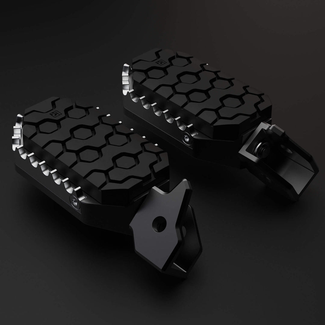 Image of Two motorcycle foot peg with rubber to protect a boot